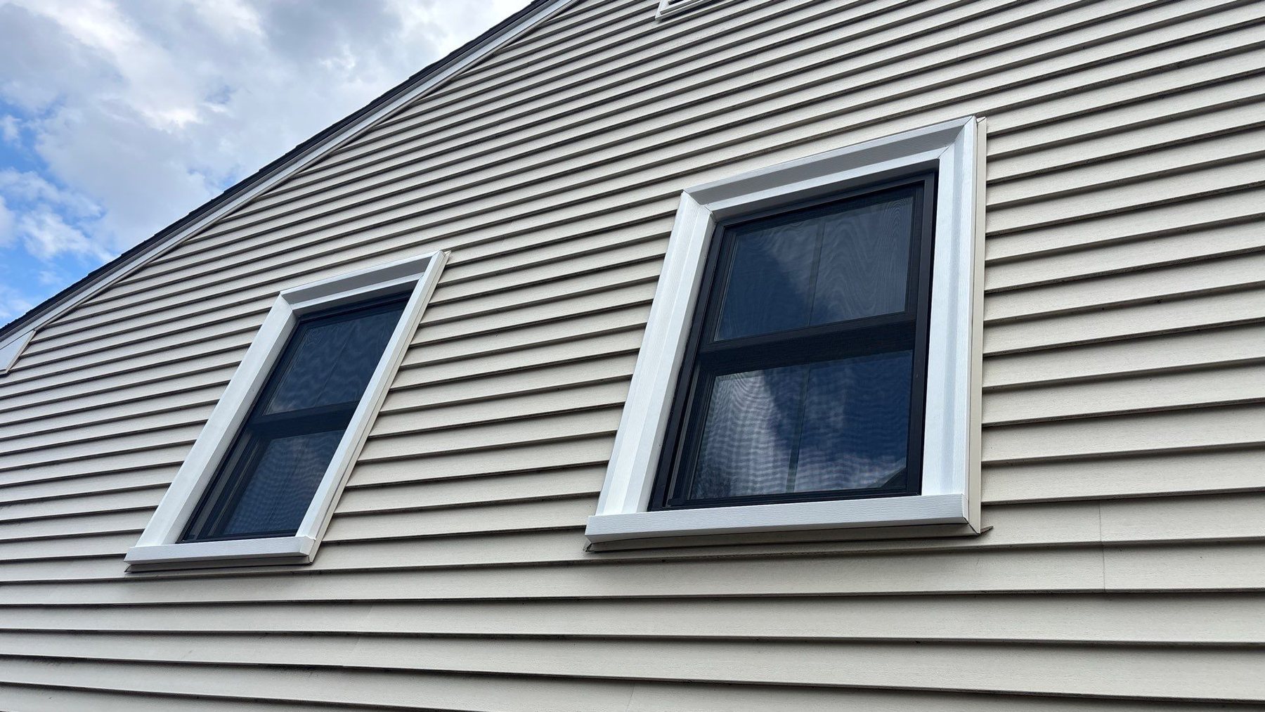 Replacement windows set into a home exterior